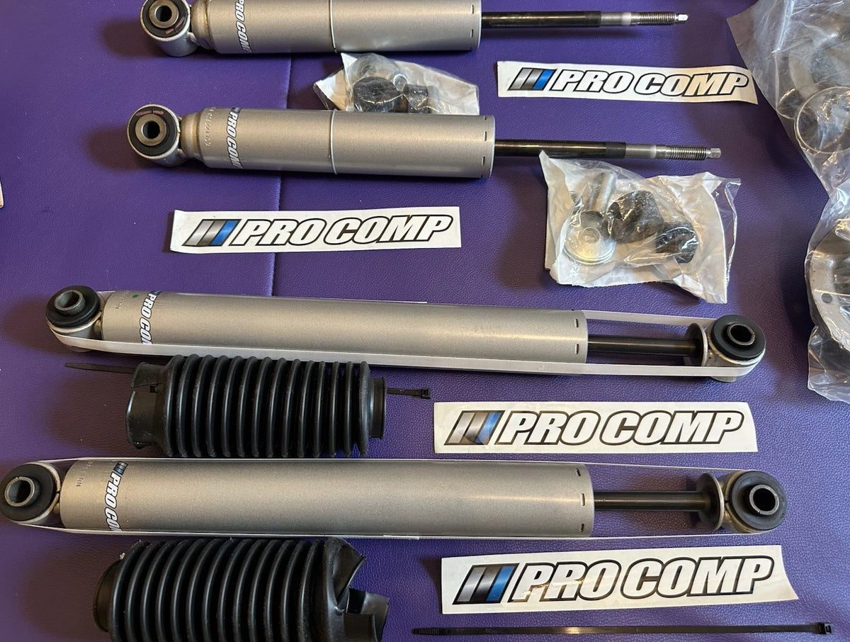 Set of 4 Pro Comp Monotube Shocks & Struts for Nissan Titan (2004–2015)